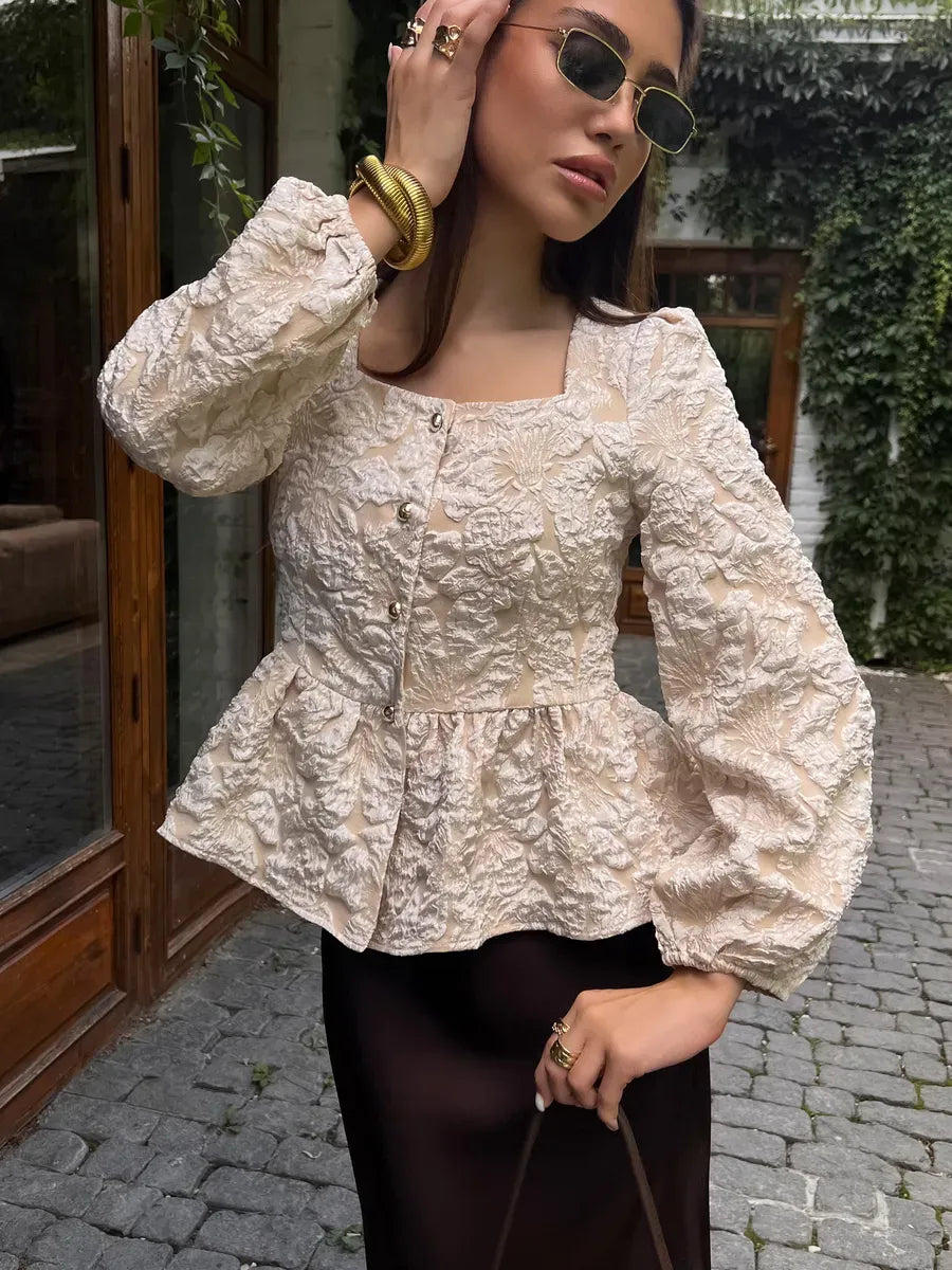 Beige jacquard peplum blouse with puff sleeves