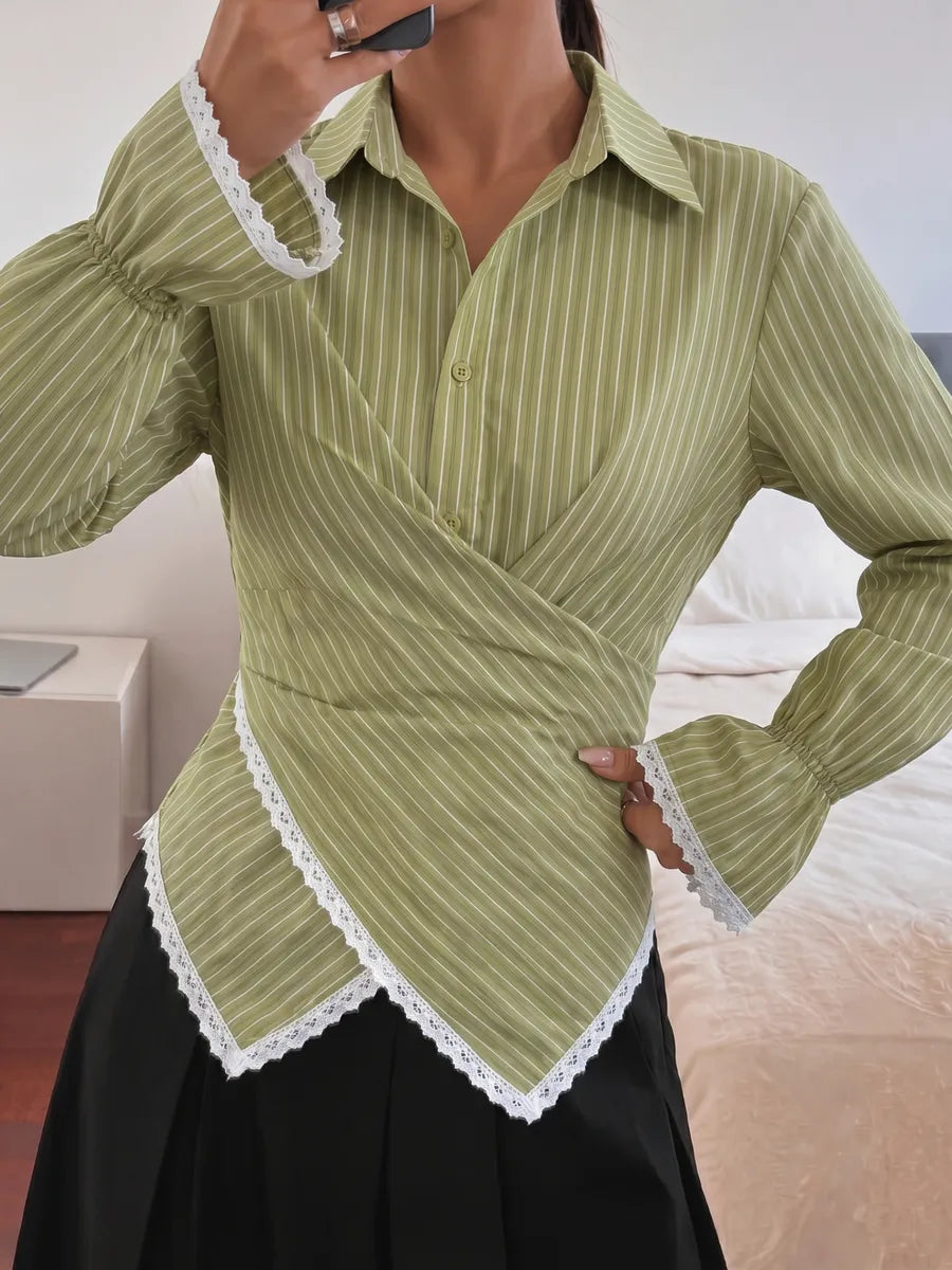 Fitted green wrap blouse with a soft asymmetric front