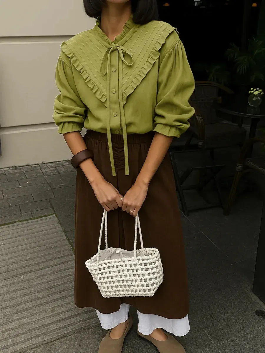 Olive green vintage-inspired blouse with puff sleeves