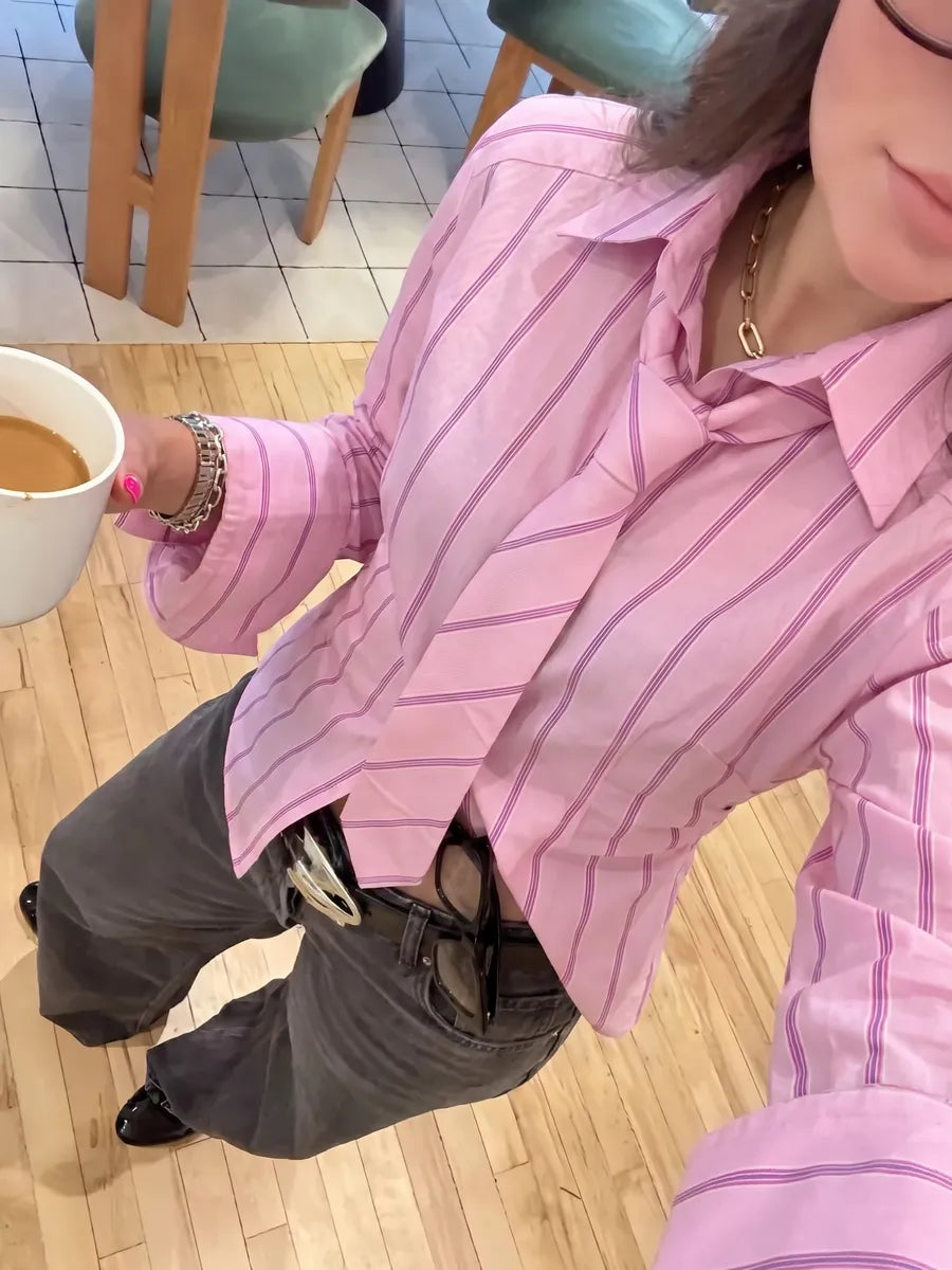Tie-neck detail on the pink cotton shirt