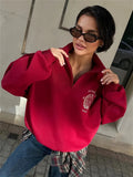 Cherry Red Half-Zip Sweatshirt with Crest Embroidery