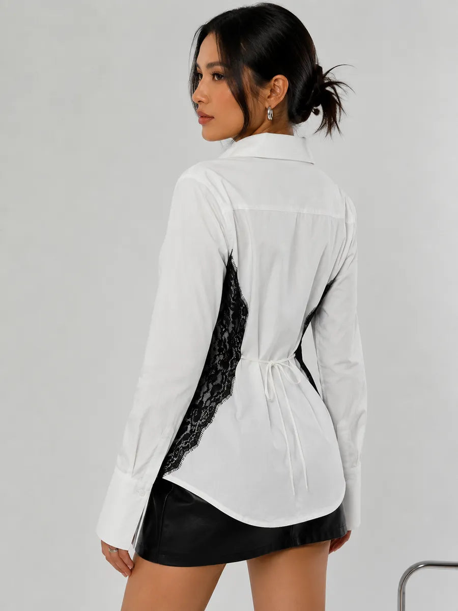 Close view of the black lace trim on the white cotton shirt