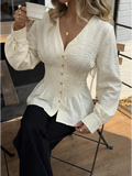 White fitted blouse with subtle textured detailing